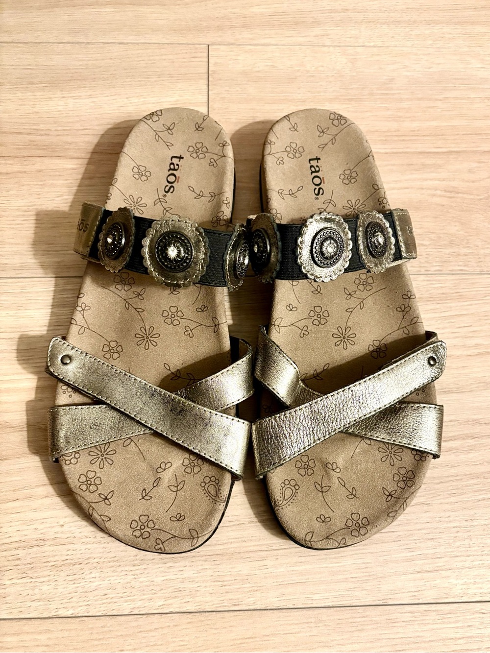 Taos Footwear metallic gold and black decorative slip-on sandals